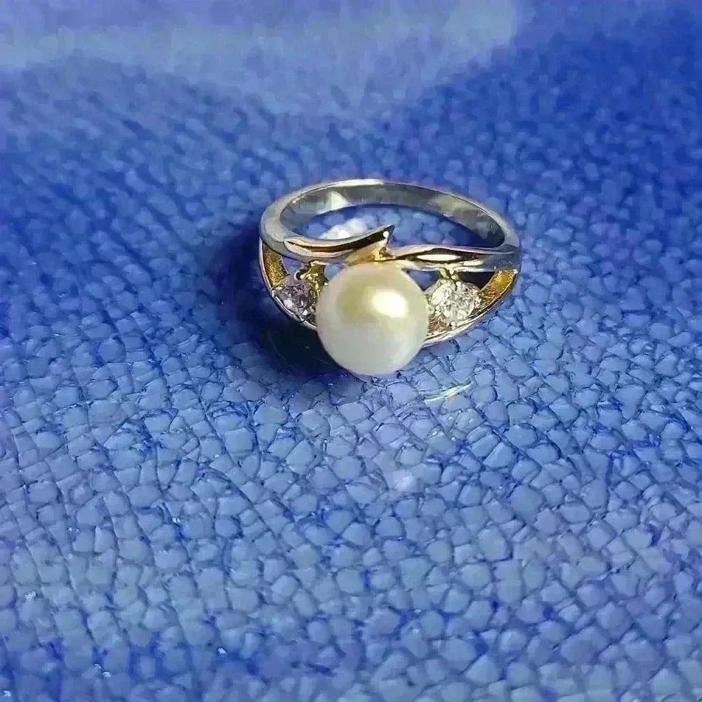 Gold tone pearl rhinestones (CZ ?) Ring size is 6 NWOT